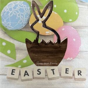 Iron silhouette bunny inside half wood egg